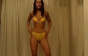 Sexy brunette babe at home stripteasing and seduci