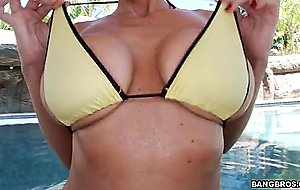 Busty milf alia janine in a sweet bikini shows off her enormous rack