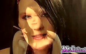 Slutty teen smoking a pink cigarette.