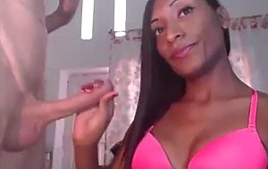 Delicious chocolate shemale stroking her bf's cock 