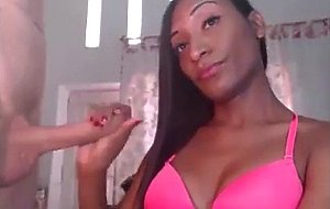 Delicious chocolate shemale stroking her bf's cock 