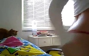 Cutie shows off her small tits and ass at home