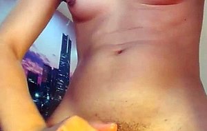 Solo ts jerkingher cock on webcam
