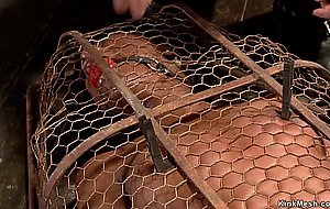 Ebony slave gets vibrated in cage