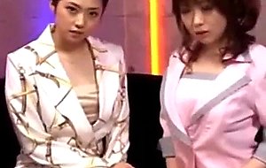 Asian girls in costumes kissing