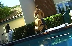 Horny young blonde with beautifull tits drops to knees and gives head by pool