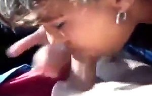 Brunette slut sucks cock in a car 
