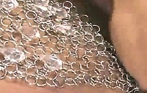 Milf in rhinestones fingers and toys her trimmed pussy