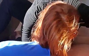 Natural redhead gives a blowjob after workout session