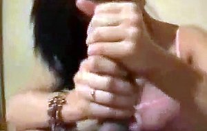 Brunette strokes the cock to a jizz blast