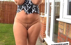 Mature neighbor walks with bare ass outdoors