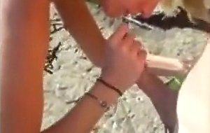 Bikini girl sucks cock on the rocky shore