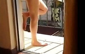 Masturbating naked in his balcony