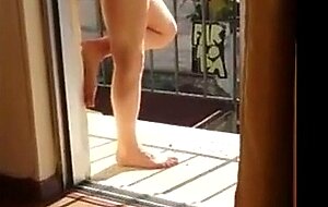 Masturbating naked in his balcony