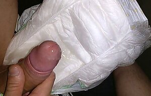 Twink cumming his wet diaper