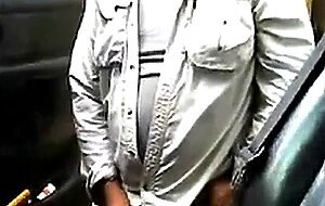 Bearded daddy strokes his cock by his truck outdoors.