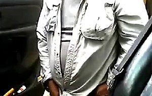 Bearded daddy strokes his cock by his truck outdoors.