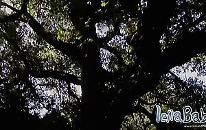Leila Babe striptease showing her big tits outdoor tree