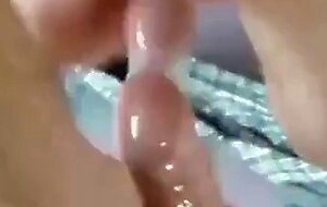 Two Guys Cum Together in a Condom