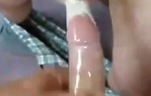 Two Guys Cum Together in a Condom