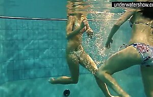 Two sexy amateurs showing their bodies off under water