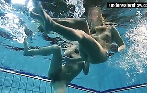 Two sexy amateurs showing their bodies off under water