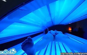 teen latina gets caught rubbing her clit while using a tanning bed