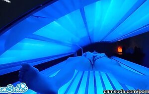 teen latina gets caught rubbing her clit while using a tanning bed