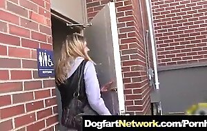 Blonde fucks a black guy in public bathroom gloryhole