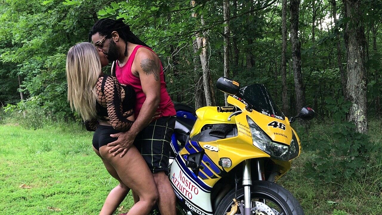 Chubby ebony teases with her hot bum and gives a BJ on a motorcycle