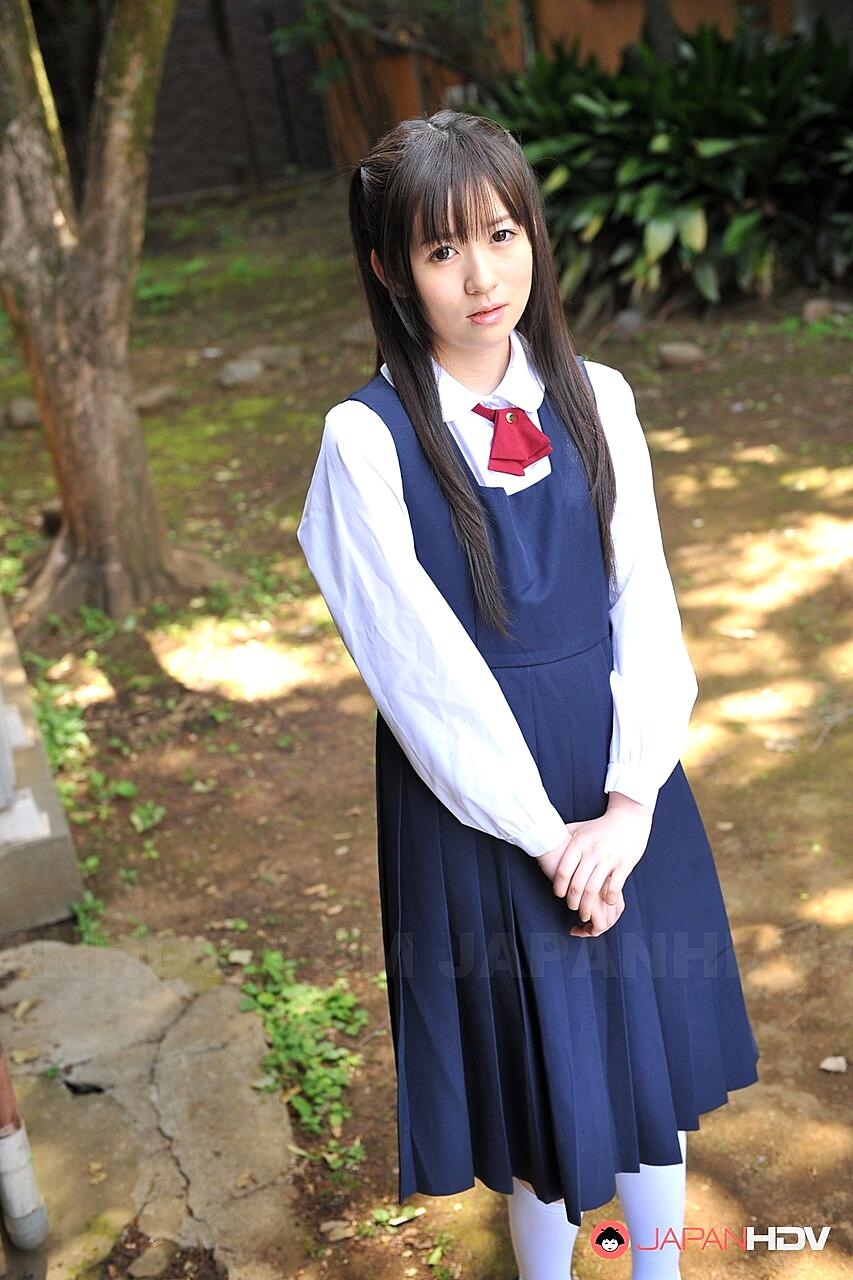 Charming Japanese babe posing in her cute school outfit in the garden, Ai Uehara