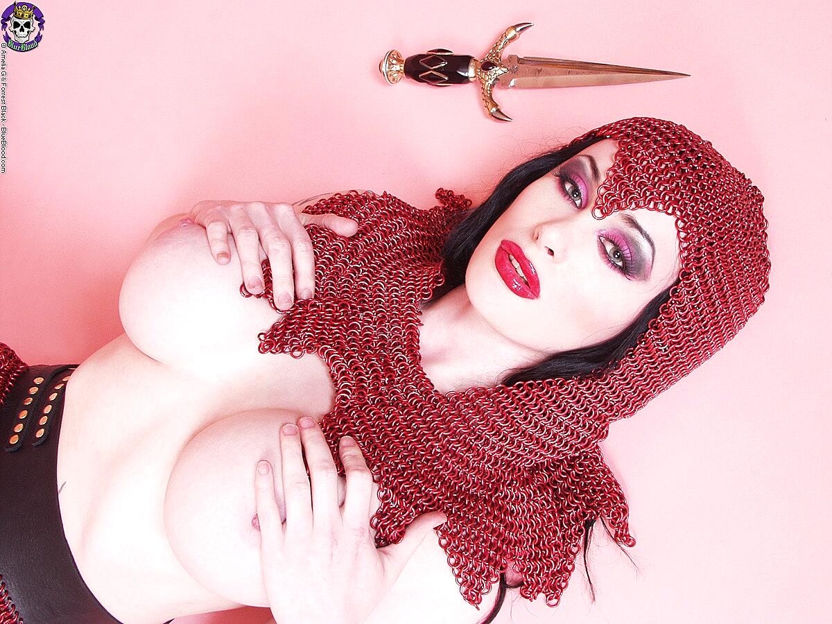 Busty Chick Morrigan Hel Licks A Dagger While Wearing Chain Mail And Otk Boots Big-Tits, Cosplay, Fetish, Mature, Milf