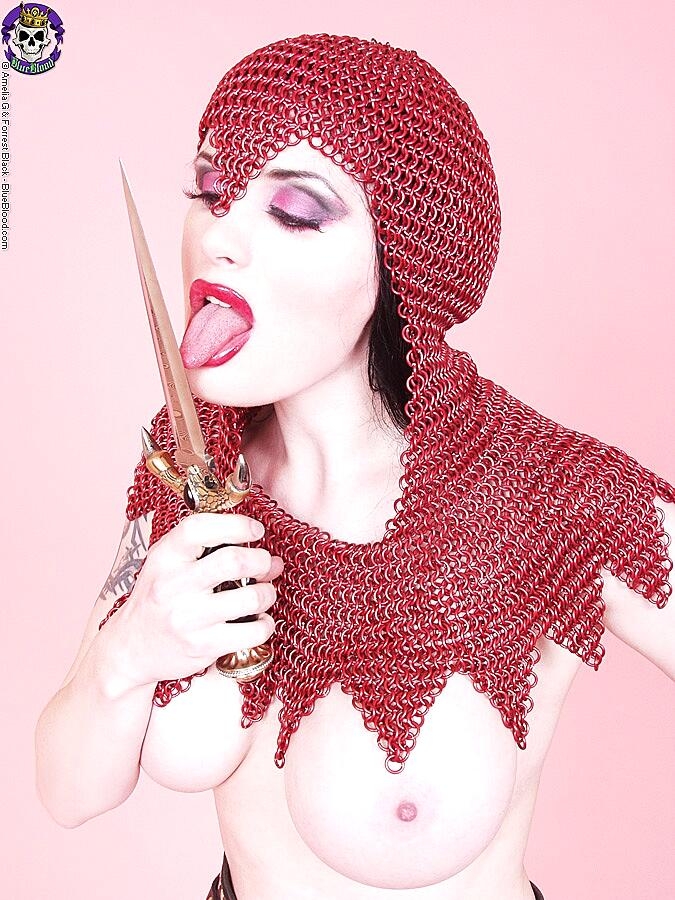 Busty Chick Morrigan Hel Licks A Dagger While Wearing Chain Mail And Otk Boots Big-Tits, Cosplay, Fetish, Mature, Milf