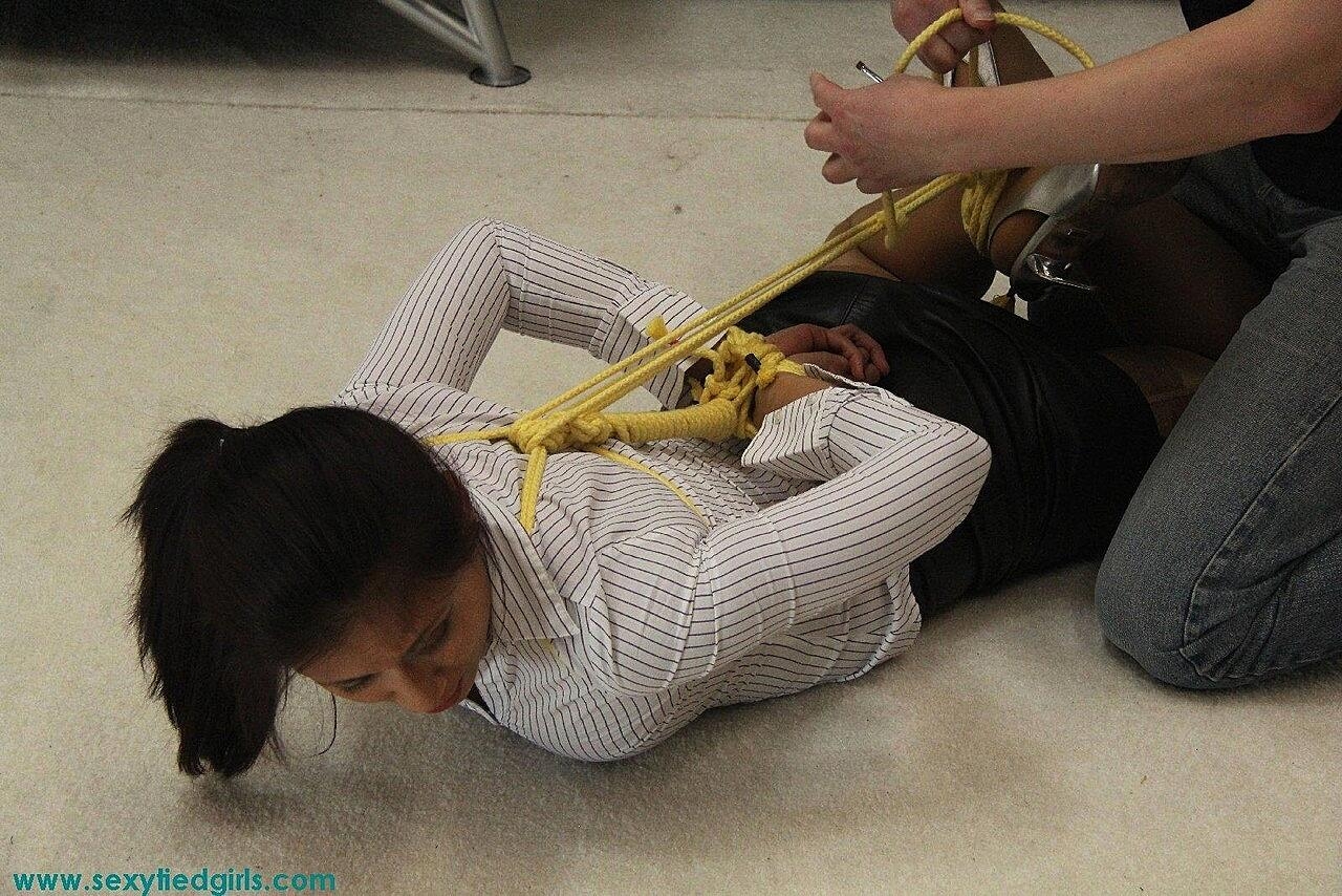 Busty Asian Girl Sports A Ball Gag While Tied Up In An Uncomfortable Position Asian, Big-Tits, Blindfold, Bondage, Clothed